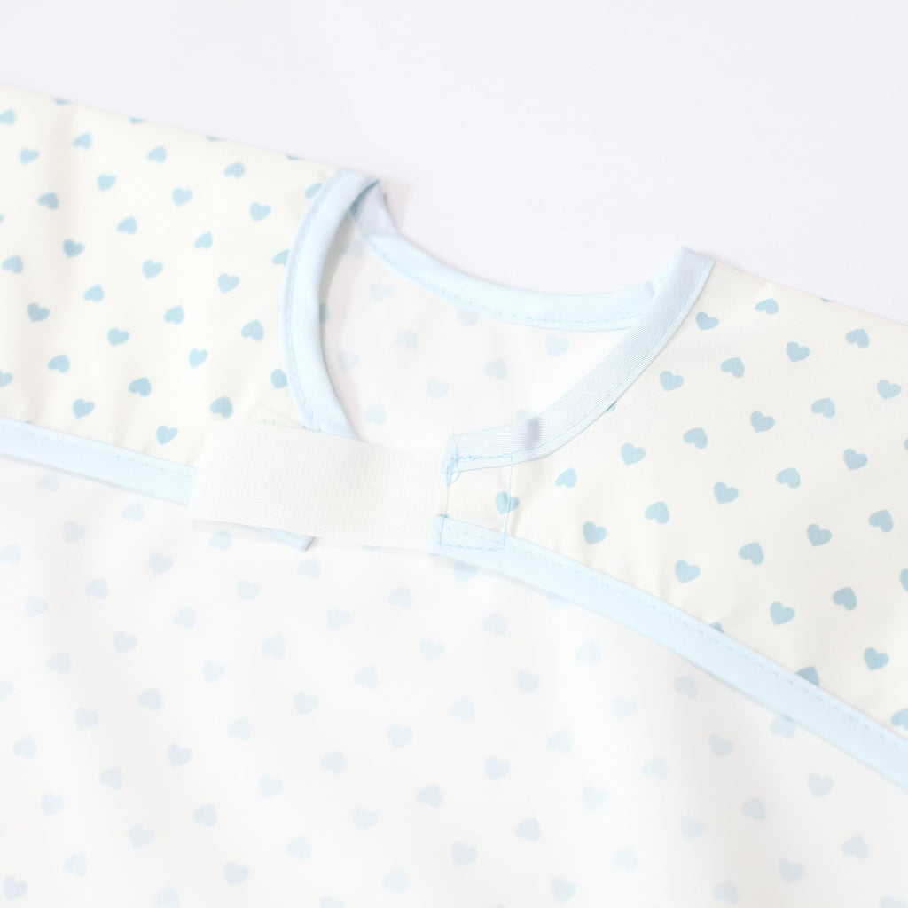 Plie Short Sleeve Waterproof Bib for Toddlers – Easy Clean Feeding Apron for Mealtime, Daycare, Self-Feeding & Messy Play, Lightweight BPA-Free Baby Bib (6–24 Months) - Blue Heart