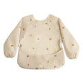 mushie Long Sleeve Baby Bib | Water Resistant Adjustable Fit (Sun)