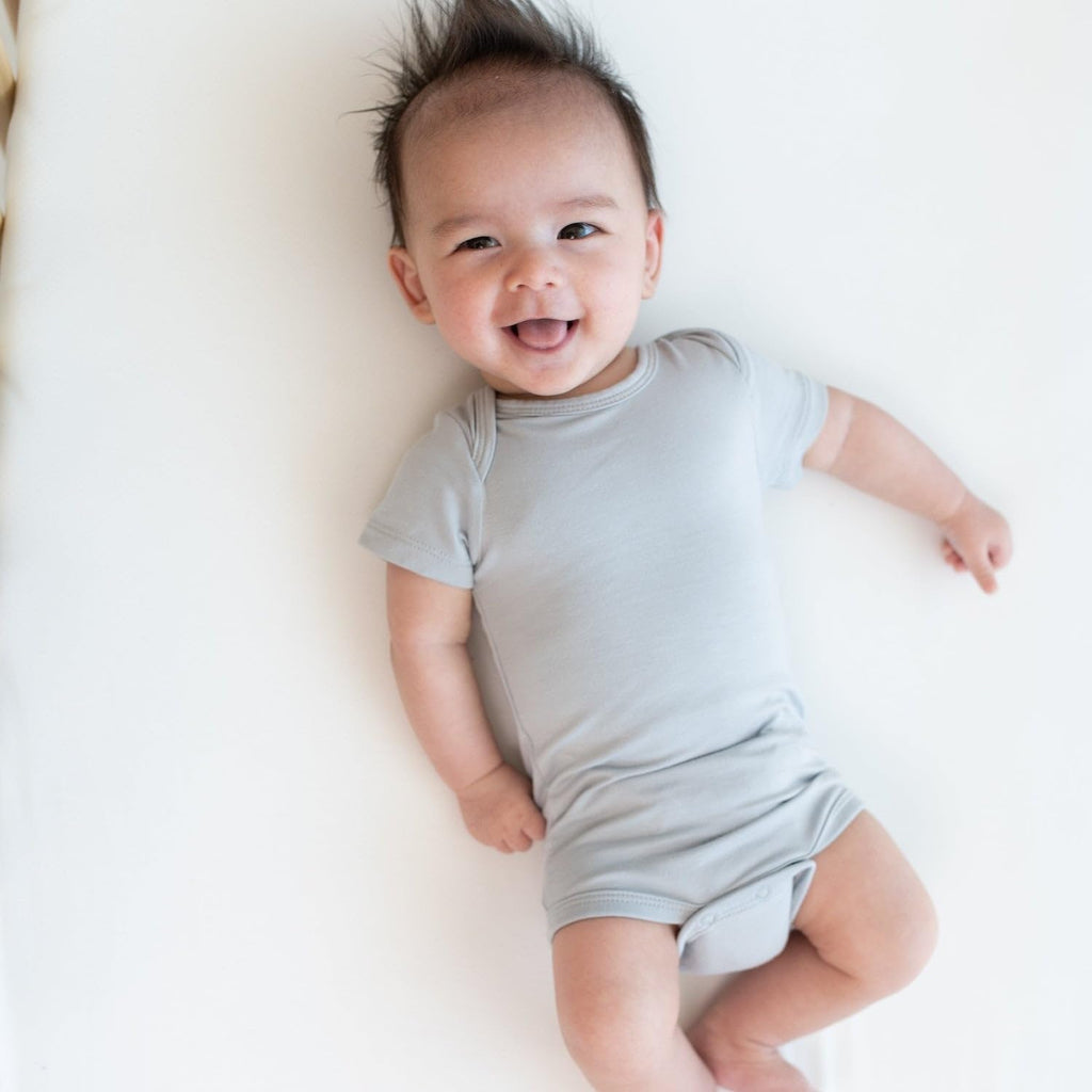 KYTE BABY Unisex Bodysuits, 2-Pack Short Sleeve Baby Bodysuits, 97% Rayon made from Bamboo, 3% Spandex (12-18 Months, Midnight+Storm)