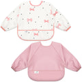 BebeBiu Long Sleeve Baby Bib, Waterproof Fabric, Full Coverage with Catch-All Pocket, Baby Smock Bib, Adjustable Sleeves Toddler bib for Ages 6-24 Months (Bows Blush, Small 6-24 Months)
