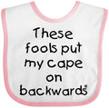 inktastic These Fools Put My Cape on Backwards Baby Bib White and Pink 10a80