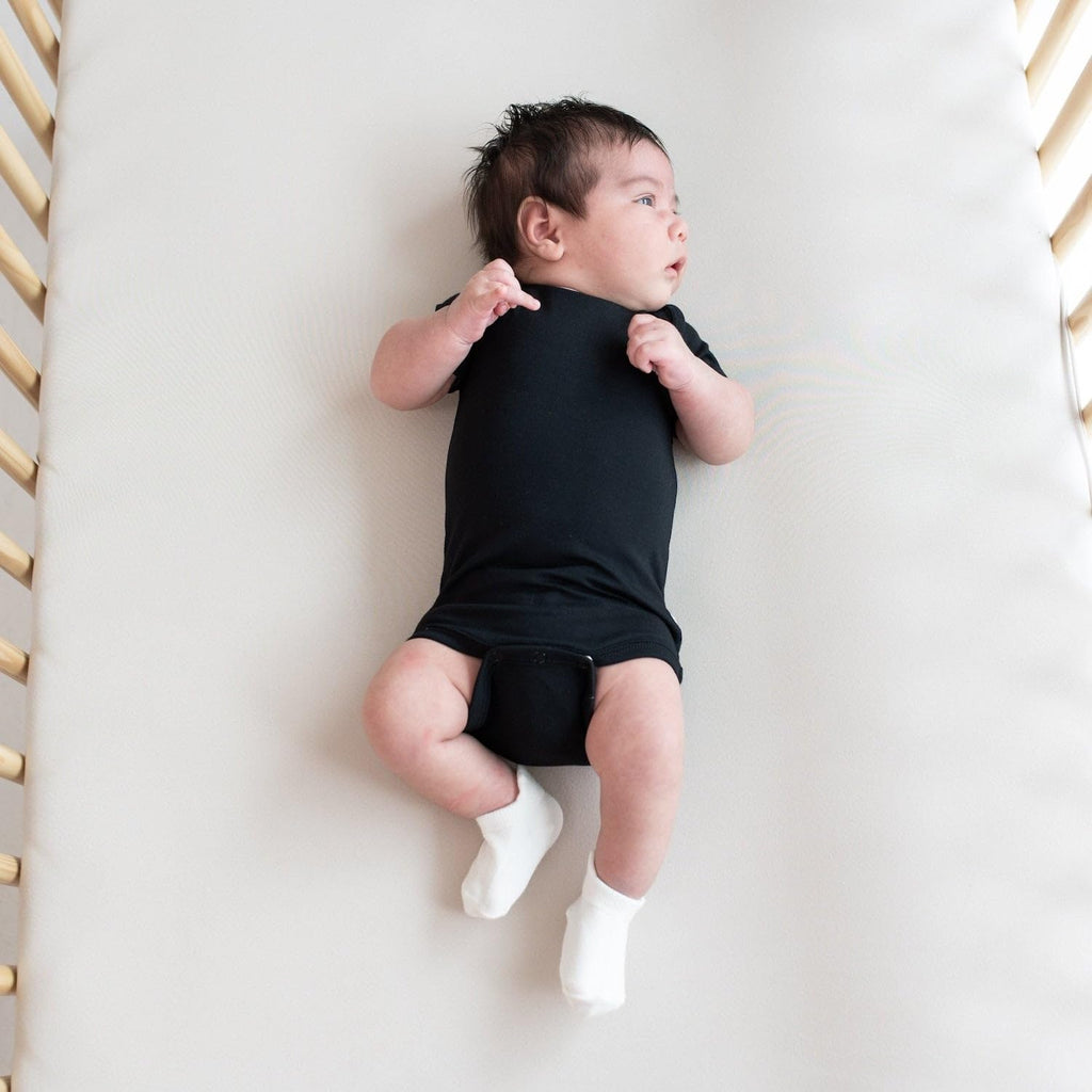 KYTE BABY Unisex Bodysuits, 2-Pack Short Sleeve Baby Bodysuits, 97% Rayon made from Bamboo, 3% Spandex (0-3 Months, Midnight+Storm)