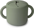 mushie Silicone Snack Cup | Spill Proof Food Container for Toddler and Baby (Dried Thyme)