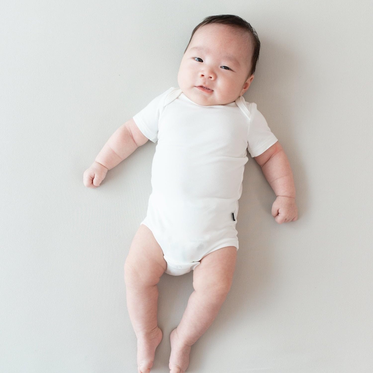 KYTE BABY Unisex Bodysuits, 2 - Pack Short Sleeve Baby Bodysuits, 97% Rayon Made from Bamboo, 3% Spandex (0-3 Months, Cloud, Storm)