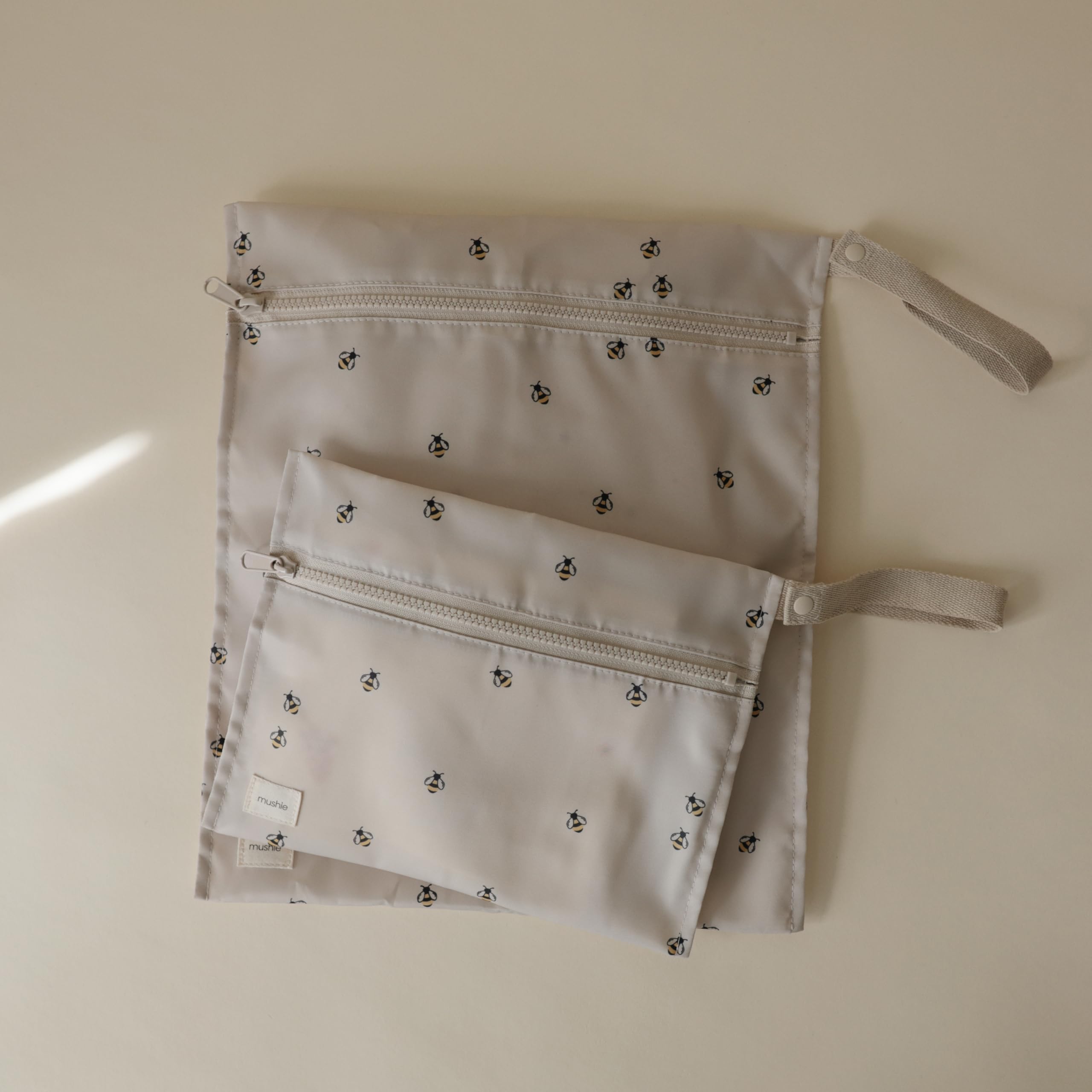 mushie Water Resistant Wet Bags | Large & Small Reusable Storage Bag for Baby Items and Travel | Zippered Pockets with Handle | Machine Washable, Set of 2 (Bees)