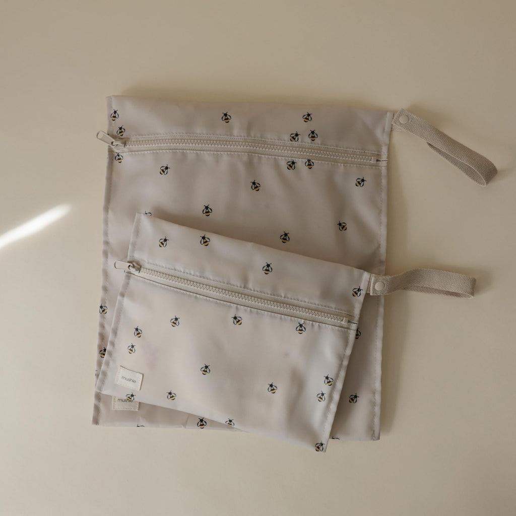 mushie Water Resistant Wet Bags | Large & Small Reusable Storage Bag for Baby Items and Travel | Zippered Pockets with Handle | Machine Washable, Set of 2 (Bees)