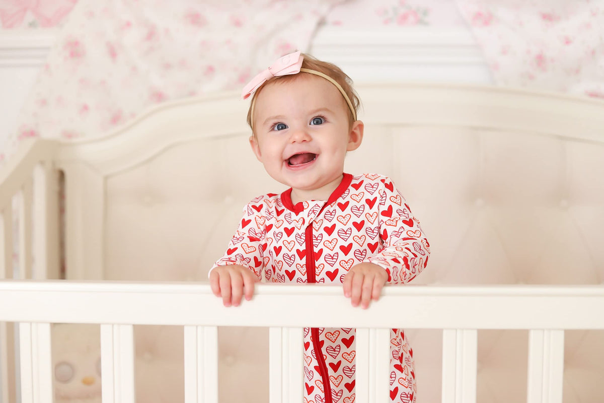 KicKee Full of Hearts Footie with Zipper, One-Piece Boy or Girl Baby Clothes (Natural Hearts - Newborn)