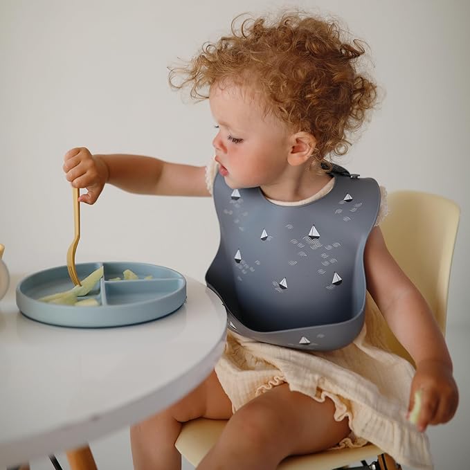 mushie Silicone Baby Bib | Adjustable Fit Waterproof Bibs (Tradewinds)