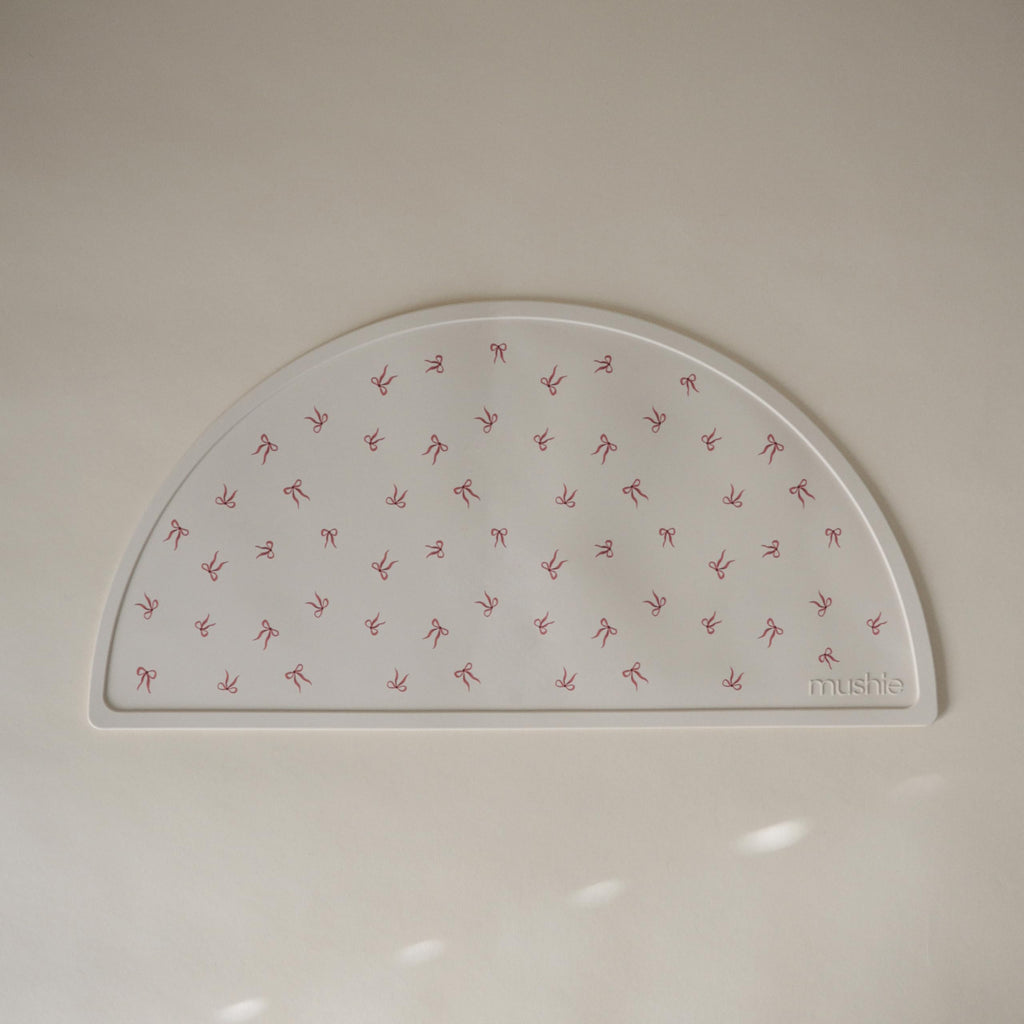 mushie Silicone Placemat for Kids | BPA-Free Non-Slip Design (Bows)