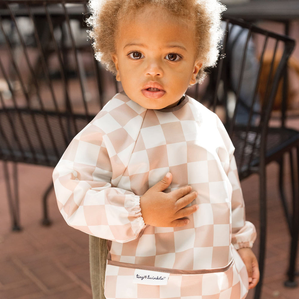 Tiny Twinkle Long Sleeve Bib for Babies & Toddlers | Waterproof Smock Bib for Eating | Machine Washable & Mess-Proof Feeding Essentials | Newborn Shower Gift (Checkers Brown, 6–24M)