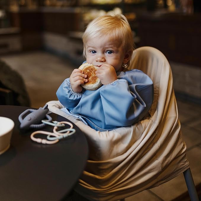 mushie Long Sleeve Baby Bib | Water Resistant Adjustable Fit for Ages 6-24 Months